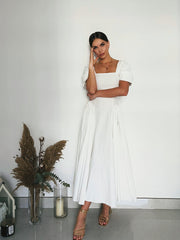 refined white ankle length dress